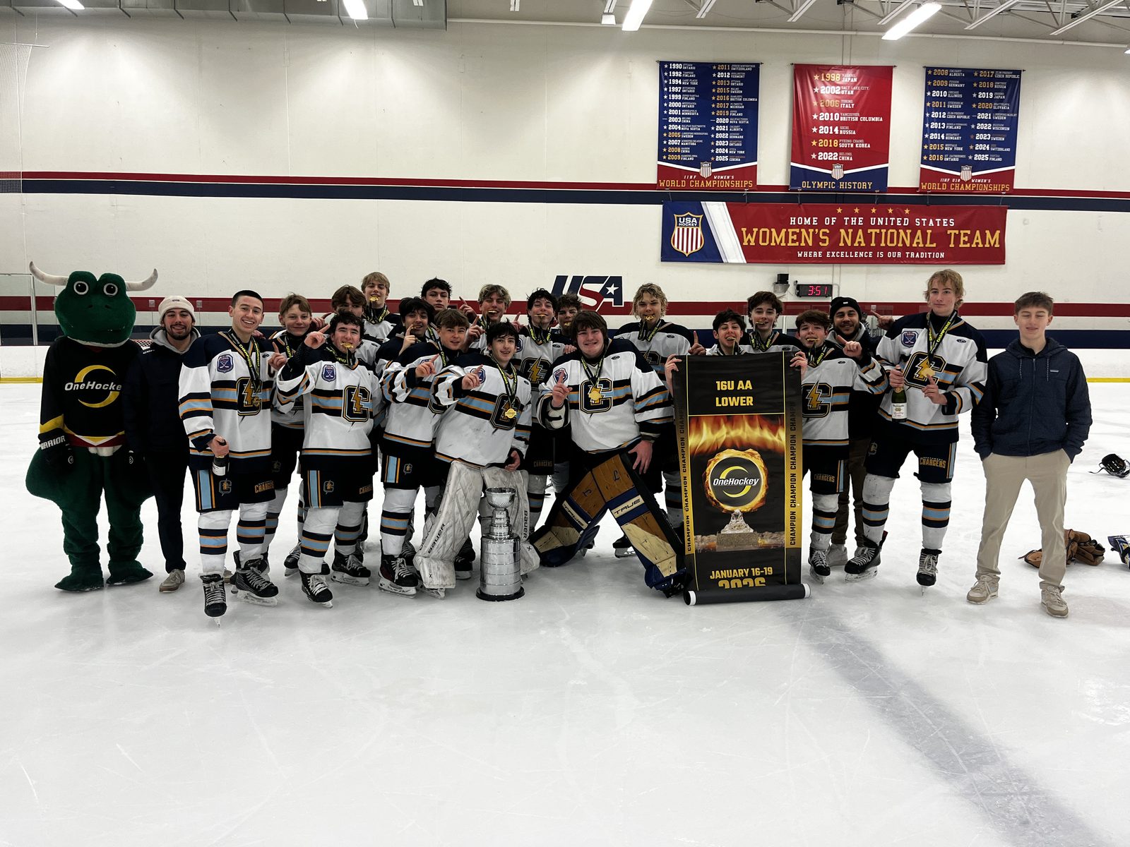 OneHockey team on the ice with the championship trophy
