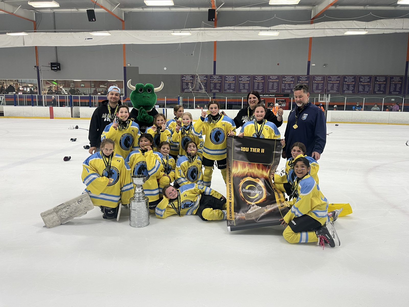 OneHockey team celebrating on the ice